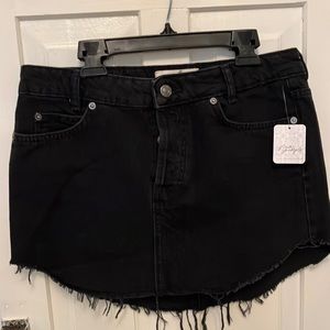 Free people black denim U shape fray hem skirt. NWT Sold Out